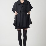PF11_Look 03 Charcoal capelet, Black jersey tank dress with charcoal wool felt pleated apron