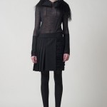 PF11_Look 17 Charcoal sheer wool pullover with techno taffeta Tibetan goat hood and felt zip cuffs, Navy lurex basketweave skirt with charcoal wool felt pleated overlay and waist band