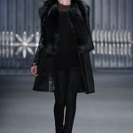 Be warm and stylish as you party hop in this suede fox-detailed coat from the Vera Wang Fall 2011 collection.