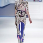 Indigo psychedelic printed chiffon V-neck top with printed stretch cotton criss cross cutaway overlay & peplum belt with indigo psychedelic printed stretch cotton legging