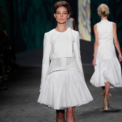 Look 3: White cotton canvas soutache embroidered sleeveless high-low top over white cotton canvas Bermuda with soutache tuxedo stripe | Photography: Dan Lecca
